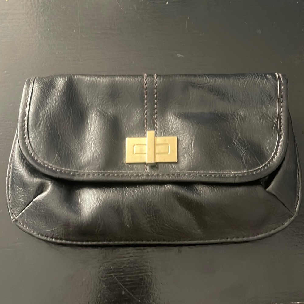 Relic clutch. Black with gold details.